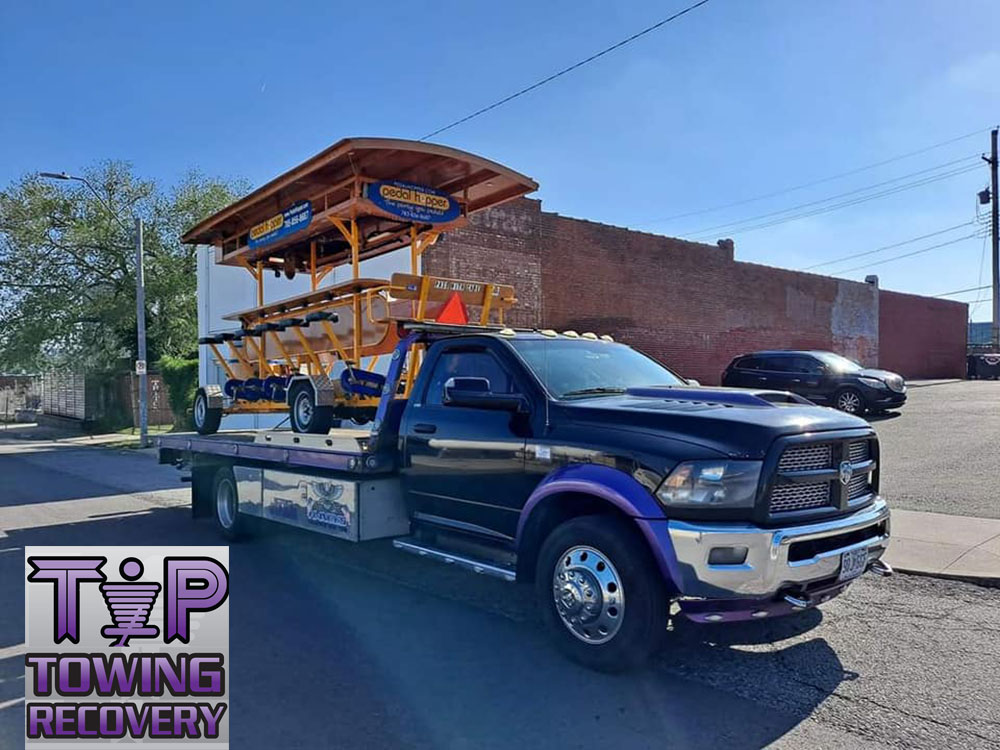 Equipment Hauling for Tip Towing and Recovery Service in the Kansas City Missouri Metro Area